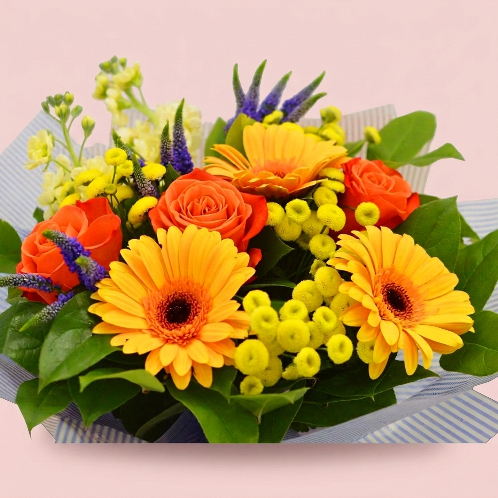 Summery bright bouquet of seasonal flowers by Victoriana Florist Main image