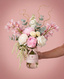 The Blush Orchid Vase flower arrangement in a glass jar with blush label by Victoriana Florist